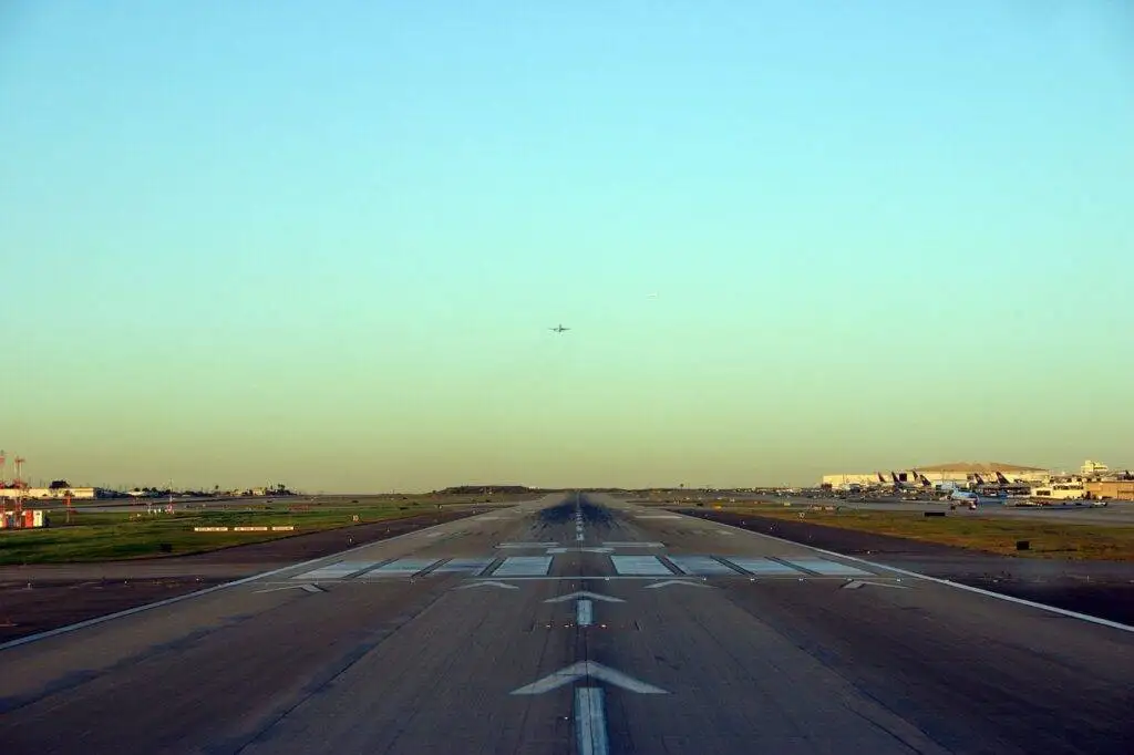 Airport runway that could be constructed with self healing concrete, designed to automatically fix surface cracks and ensure continuous, safe air travel operations